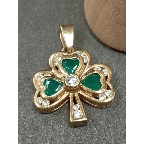 702 - 9ct gold green and clear stone shamrock pendant 1cm weight 2.72 grams