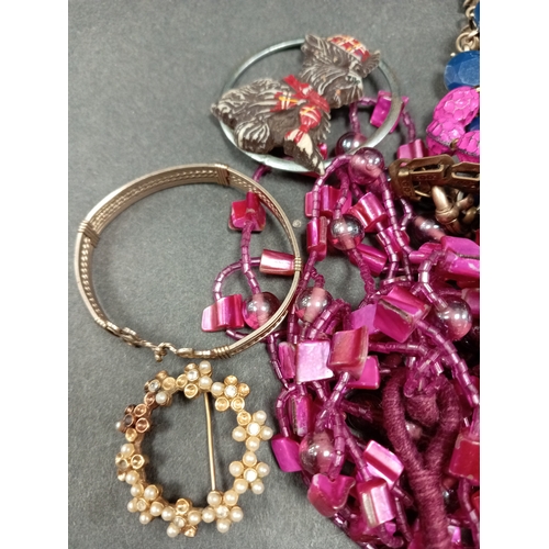 708 - Job lot of vintage costume jewellery includes brooches, beaded necklacesand a bangle