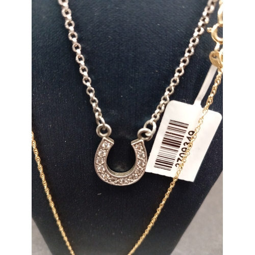 766 - 925 silver diamanté horse shoe necklace L 40cm and a new yellow metal on 925 silver diamanté roller ... 