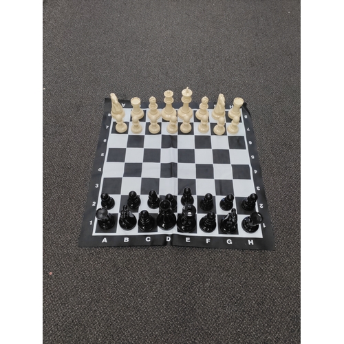 417 - Complete VERY large plastic chess set. Small tear on D,1.  Board H 90cm x W 90cm