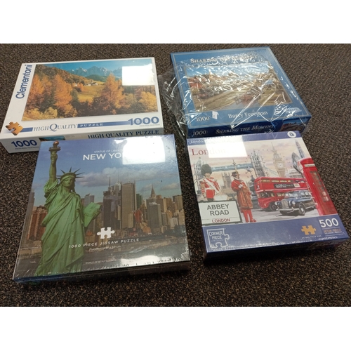 420 - Four sealed jigsaw puzzles includes Statue of liberty New York, Clemontoni, Abbey Road London and Sh... 