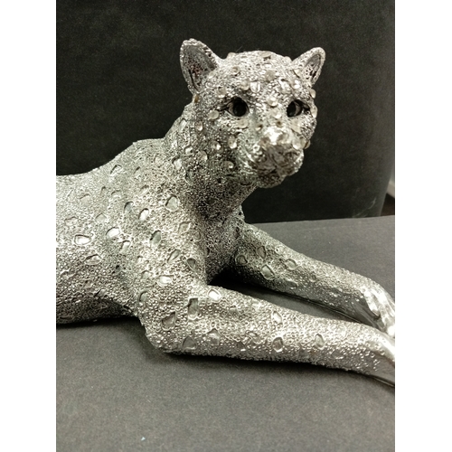 431 - Silver coloured cheetah with diamanté face resin figure. H 14cm x W 31cm