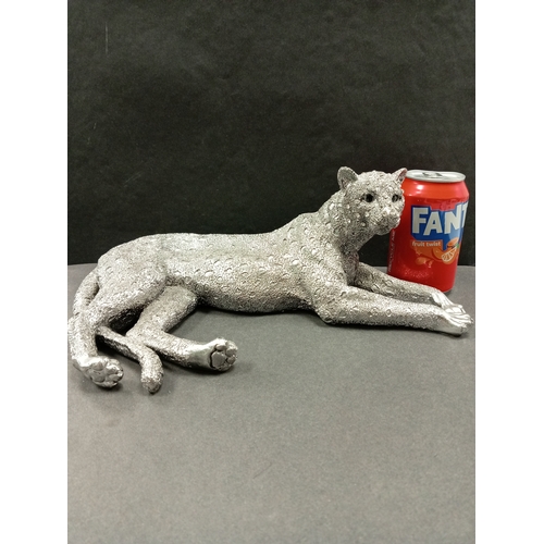 431 - Silver coloured cheetah with diamanté face resin figure. H 14cm x W 31cm