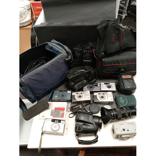 436 - Job lot of cameras, camera bags, video camera's, carry cases, flashes and lens. Includes Kodak, Pent... 