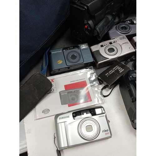 436 - Job lot of cameras, camera bags, video camera's, carry cases, flashes and lens. Includes Kodak, Pent... 