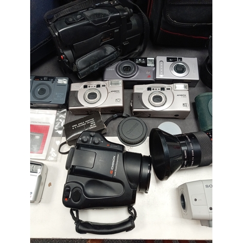 436 - Job lot of cameras, camera bags, video camera's, carry cases, flashes and lens. Includes Kodak, Pent... 