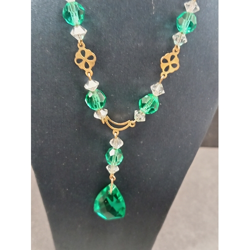 675 - 9ct gold Antique Art Deco clear and green glass faceted necklace L 40cm. Weight 7.22 grams