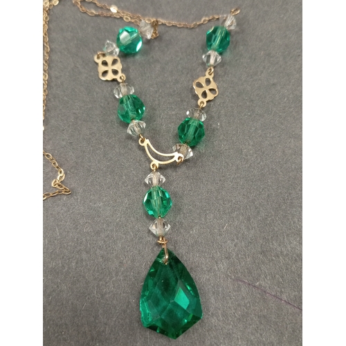 675 - 9ct gold Antique Art Deco clear and green glass faceted necklace L 40cm. Weight 7.22 grams