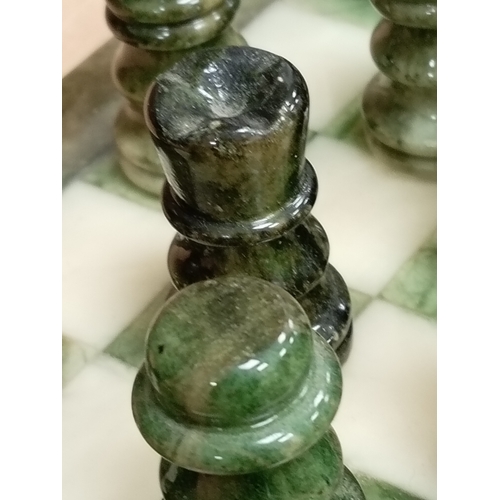 440 - Marble miniature chess board with full chess set pieces 24cm x 24cm