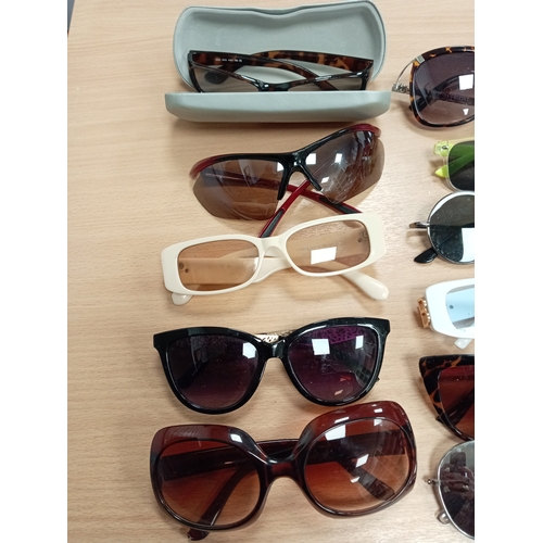 451 - Job lot of vintage sunglasses to include Storm sunglasses in original case and Fat Face sunglasses.