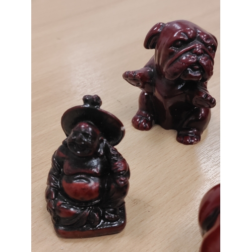 455 - A job lot of red resin animals and 2 Budda figures.