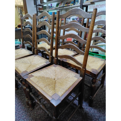 462 - A set of 6 antique ladder back woven rush seat chairs.