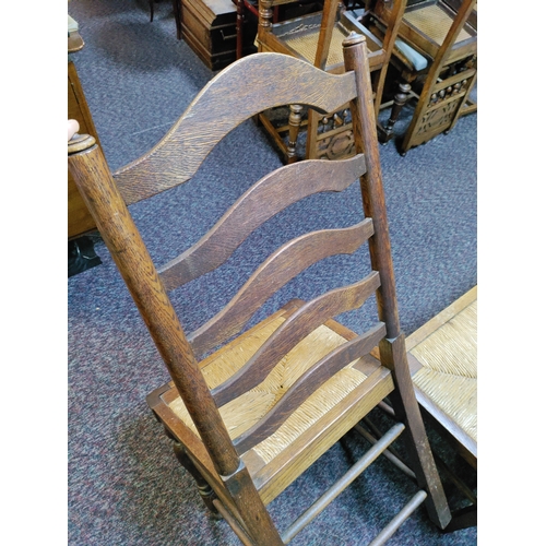 462 - A set of 6 antique ladder back woven rush seat chairs.