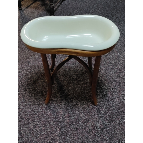 530 - Antique ceramic baby bath with bamboo stand. Bath stamped Digoin France. H 46cm x W 29cm x D 48cm.