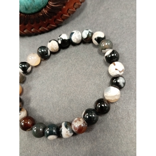 681 - Black flower Agate beaded bracelet 7cm diameter and a brown leather and turquoise stone nevajo style... 