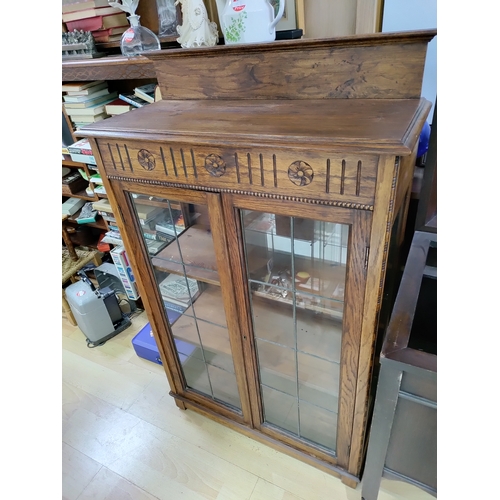 475 - Glass and lead framed display cabinet. H 124cm x W 75cm x D 34cm