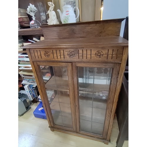 475 - Glass and lead framed display cabinet. H 124cm x W 75cm x D 34cm