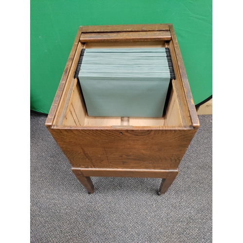 478 - Mid Century Oak tambour top filing cabinet on wheel base with original key