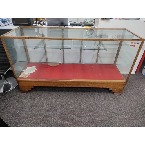 497 - Antique Oak Showcase shop counter display cabinet made by Dudley & Co with glass shelves and glass t... 