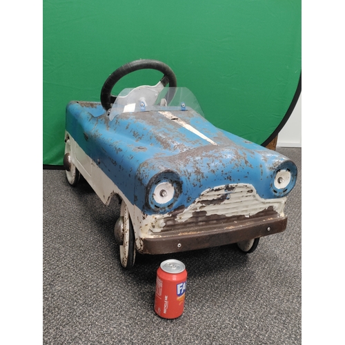 499 - 1950s pedal car with tyres, steers and moves well.