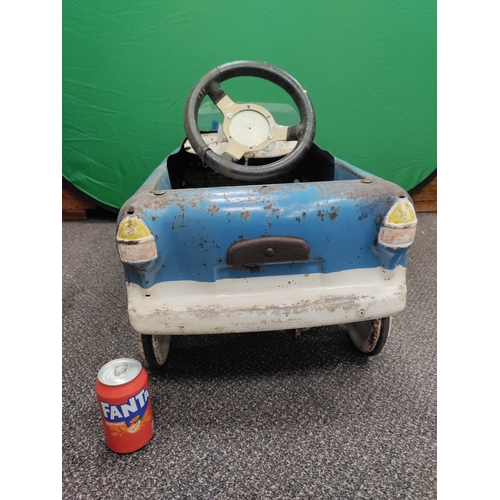 499 - 1950s pedal car with tyres, steers and moves well.