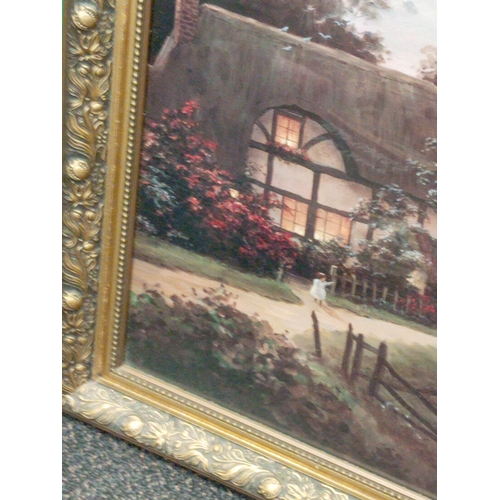 558 - Ornate framed print of a cottage by the river with children and dog. H 58CM x W 69cm