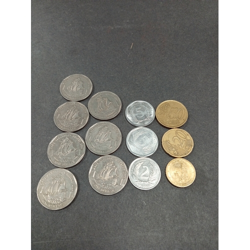 570 - East Caribbean and Euro coins, includes seven one dollar coins, two five cents, one two cents and th... 