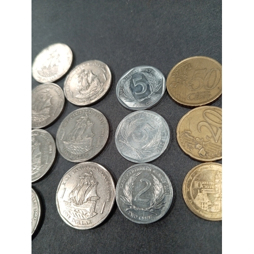 570 - East Caribbean and Euro coins, includes seven one dollar coins, two five cents, one two cents and th... 