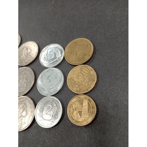 570 - East Caribbean and Euro coins, includes seven one dollar coins, two five cents, one two cents and th... 