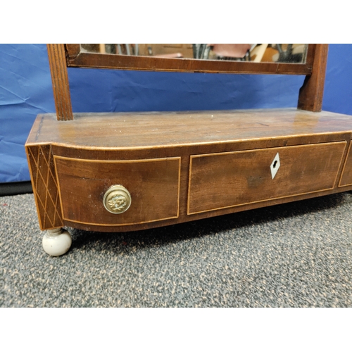 573 - Antique inlaid swivel mirror with three draws and brass handles