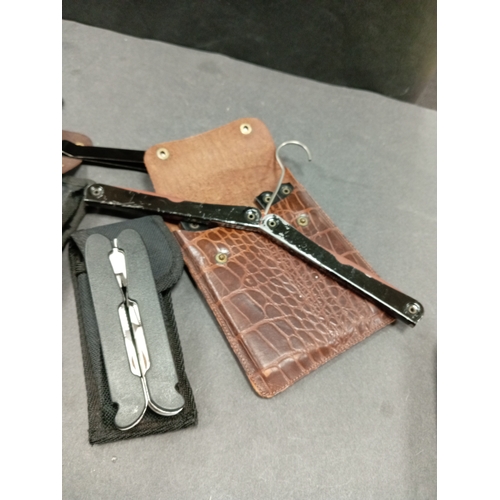 578 - Job lot of vintage men's accessories includes two wallets with travel hangers, nail clippers and fol... 