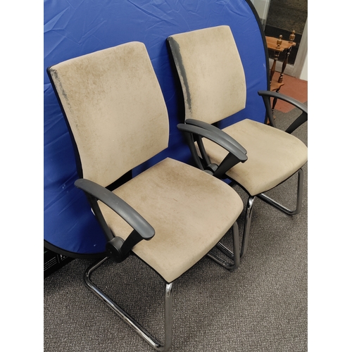 593 - A pair of beige office chairs.