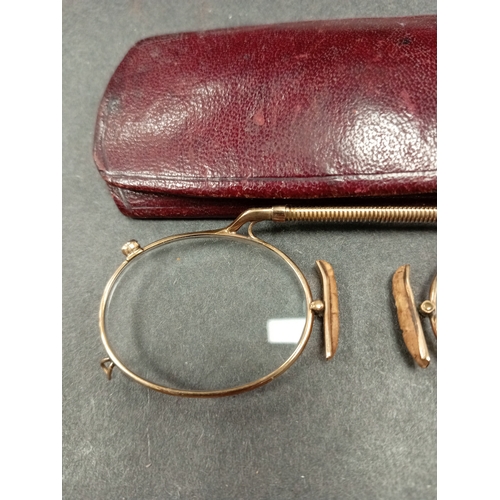 684 - Antique 9ct gold nose pinch glasses in a leather case. Weight 14.14 grams