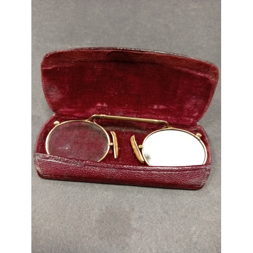 684 - Antique 9ct gold nose pinch glasses in a leather case. Weight 14.14 grams