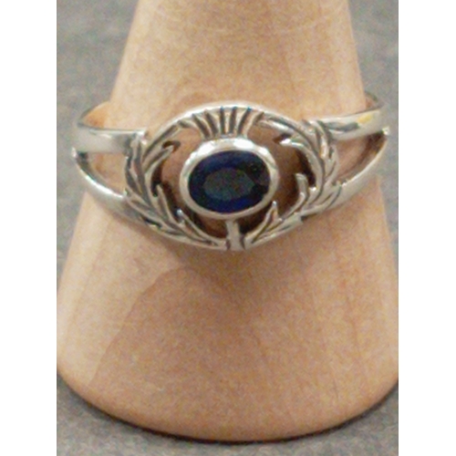 692 - 925 silver thistle ring with blue stone size Q