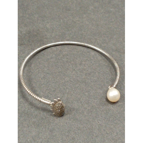 704 - 925 silver  bangle with faux pearl and diamanté stone eye detail size 6cm diameter