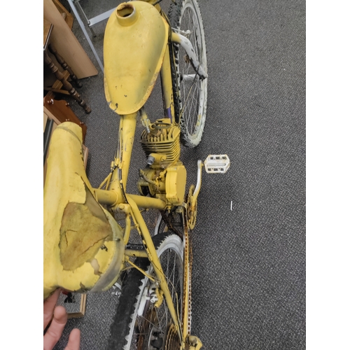 598 - A pedal bike which has been converted to petrol and partially sprayed yellow. AF