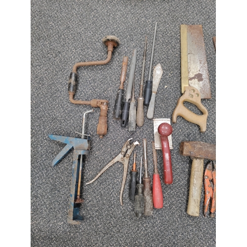 436 - A job lot of vintage hand tools, collection consists of saws, crowbar, chisels, files and more.