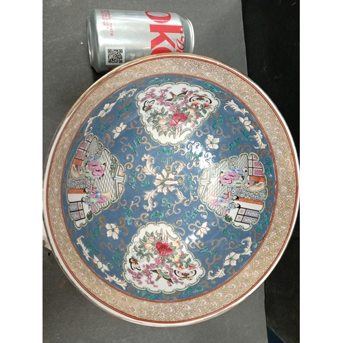 487 - Large Oriental bowl, stamped base with floral decoration 26cm diameter.