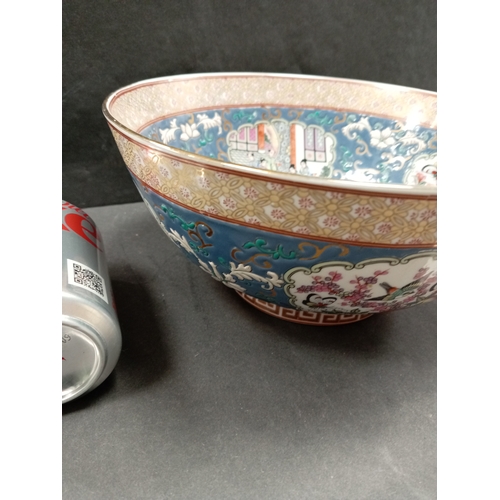 487 - Large Oriental bowl, stamped base with floral decoration 26cm diameter.