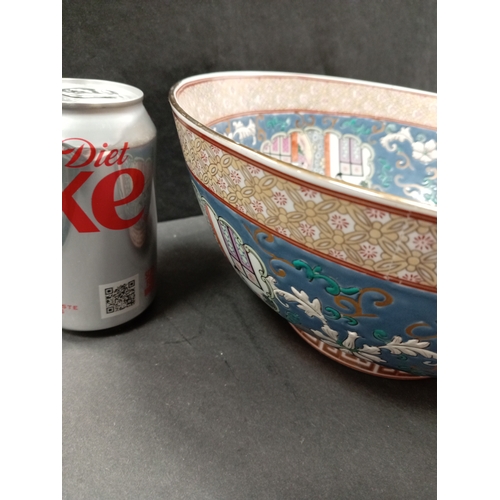 487 - Large Oriental bowl, stamped base with floral decoration 26cm diameter.