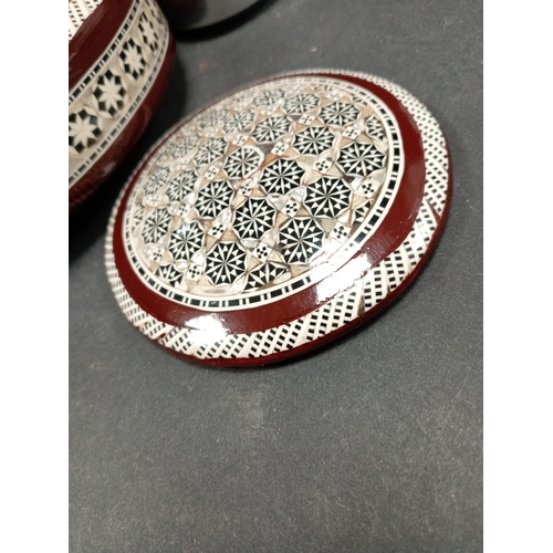 490 - Mother of pearl inlaid wooden ethnic jewellery box. 18cm diameter