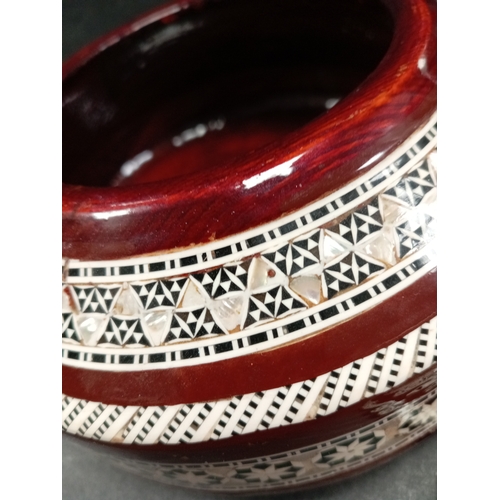 490 - Mother of pearl inlaid wooden ethnic jewellery box. 18cm diameter