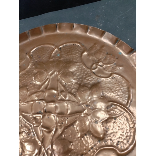 492 - Arts and crafts copper tray 32cm diameter.