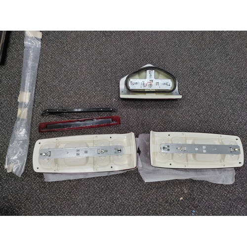 445 - An assortment of brand new caravan brake / signalling lights. Brake lights and brake bar are HELLA