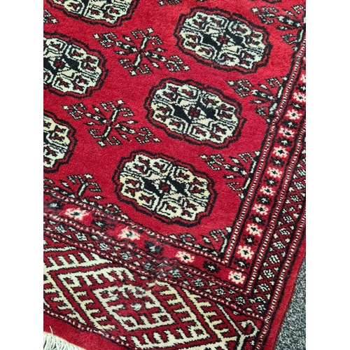 500 - Vintage Red Patterned Persian Rug. Measures 95cm x 64cm.