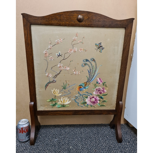 510 - Wooden fire screen guard with embroidered South Asian pattern of peacock & flowers. Measures H69cm x... 