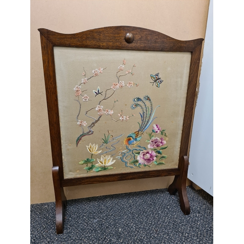 510 - Wooden fire screen guard with embroidered South Asian pattern of peacock & flowers. Measures H69cm x... 