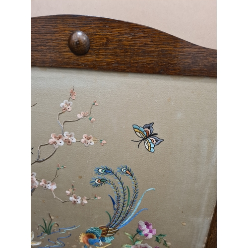 510 - Wooden fire screen guard with embroidered South Asian pattern of peacock & flowers. Measures H69cm x... 