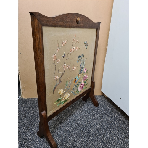 510 - Wooden fire screen guard with embroidered South Asian pattern of peacock & flowers. Measures H69cm x... 